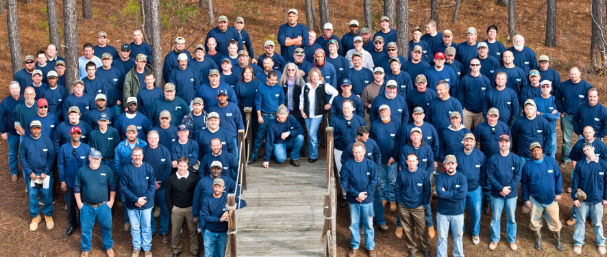 Group photo of the Art Plumbing employees standing outside